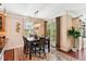 Elegant dining room features a chandelier, French doors, and a decorative rug at 2017 Woodland Shores Rd, Charleston, SC 29412