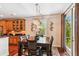 Dining area with wood table and chairs, a decorative chandelier, and French doors at 2017 Woodland Shores Rd, Charleston, SC 29412