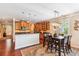 Cozy dining area off kitchen with chandelier and dining table for six near a large window at 2017 Woodland Shores Rd, Charleston, SC 29412