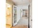 Hallway with open doorways that showcase the house's open floor plan and natural light at 2017 Woodland Shores Rd, Charleston, SC 29412