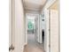 Hallway view showcasing neutral walls, carpets, and multiple doorways with white doors at 2017 Woodland Shores Rd, Charleston, SC 29412