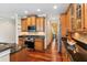 Well-equipped kitchen with stainless steel appliances, dark countertops, and wooden cabinetry at 2017 Woodland Shores Rd, Charleston, SC 29412