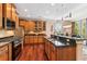 Spacious kitchen with granite countertops, stainless steel appliances, and wooden cabinets at 2017 Woodland Shores Rd, Charleston, SC 29412