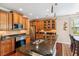 Bright kitchen featuring custom cabinetry, granite countertops, and modern stainless steel appliances at 2017 Woodland Shores Rd, Charleston, SC 29412