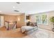 Cozy living room features a lounge chair, desk, and natural light from large windows at 2017 Woodland Shores Rd, Charleston, SC 29412