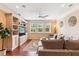 Cozy living room with built-in shelves, a ceiling fan, and a large, comfortable sofa at 2017 Woodland Shores Rd, Charleston, SC 29412