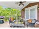 Spacious screened porch with plush seating and views of the lush backyard, perfect for outdoor relaxation and entertaining at 2017 Woodland Shores Rd, Charleston, SC 29412