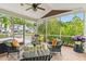 Comfortable screened porch with plush seating and elegant decor, a serene space for relaxation and entertaining at 2017 Woodland Shores Rd, Charleston, SC 29412