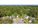 Aerial view of a home nestled in a leafy neighborhood with mature trees and a circular driveway at 206 Challis Ct, Goose Creek, SC 29445