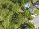 Aerial view of a home with a lush backyard, a swimming pool, and mature trees at 206 Challis Ct, Goose Creek, SC 29445