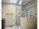 Bright bathroom featuring glass shower, tiled walls, skylight, and stylish fixtures at 206 Challis Ct, Goose Creek, SC 29445