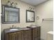 Well-lit bathroom featuring double sinks with granite countertops and modern fixtures at 206 Challis Ct, Goose Creek, SC 29445