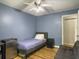 This bedroom has hardwood floors and a comfy futon at 206 Challis Ct, Goose Creek, SC 29445