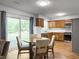 Cozy dining area with a table and chairs, adjacent to the kitchen and sliding glass door at 206 Challis Ct, Goose Creek, SC 29445