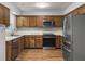 Functional kitchen with stainless steel appliances, wood cabinets, and laminate countertops at 206 Challis Ct, Goose Creek, SC 29445