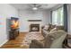 Cozy living room features a fireplace, comfortable seating, and natural light through the windows at 206 Challis Ct, Goose Creek, SC 29445