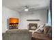 Living room area showcasing a fireplace, ceiling fan, neutral walls, and comfortable furnishings at 206 Challis Ct, Goose Creek, SC 29445