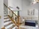 Open-concept living room with wood staircase, neutral walls, modern decor, and plush seating at 206 Challis Ct, Goose Creek, SC 29445