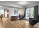 Multi-purpose room with desk, chair and a sitting area with natural light. Perfect for a home office at 206 Challis Ct, Goose Creek, SC 29445