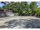 Outdoor basketball court with mature trees and a building visible behind the court at 21 Rivers Point Row # 3C, Charleston, SC 29412