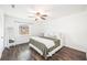 Bright bedroom features wood-look floors, ceiling fan, and a full-length mirror at 21 Rivers Point Row # 3C, Charleston, SC 29412