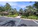 Exterior view of the brick clubhouse with ample parking and landscaping at 21 Rivers Point Row # 3C, Charleston, SC 29412