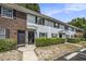 Exterior shot of the townhome showcasing well-maintained brick and siding with neat landscaping and parking access at 21 Rivers Point Row # 3C, Charleston, SC 29412