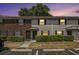 Charming exterior of townhomes with brick and gray siding, manicured shrubs, and convenient parking spaces at 21 Rivers Point Row # 3C, Charleston, SC 29412