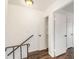 Hallway with stairs leads to multiple rooms and a linen closet, all painted white at 21 Rivers Point Row # 3C, Charleston, SC 29412