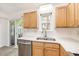 Well-lit kitchen featuring white countertops, wood cabinets, and stainless steel appliances at 21 Rivers Point Row # 3C, Charleston, SC 29412