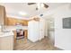 Spacious kitchen with wooden cabinets, modern appliances, and views to the living space at 21 Rivers Point Row # 3C, Charleston, SC 29412