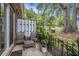 View of a patio with outdoor seating, landscaping, and a fenced yard at 21 Rivers Point Row # 3C, Charleston, SC 29412