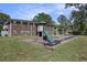 Neighborhood playground with slide and swings set in front of brick apartment buildings at 21 Rivers Point Row # 3C, Charleston, SC 29412