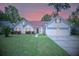 Charming single Gathering home with a well-manicured lawn and two-car garage nestled among mature trees at 217 Smithfield Ave, Summerville, SC 29485