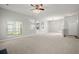 Bright and airy living room with neutral carpeting and ample space for entertaining at 217 Smithfield Ave, Summerville, SC 29485