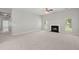 Spacious living room features neutral carpeting, fireplace, and plenty of natural light at 217 Smithfield Ave, Summerville, SC 29485