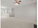 Large, neutrally decorated living room with carpet, ceiling fan, and lots of natural light at 217 Smithfield Ave, Summerville, SC 29485
