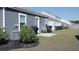 Well-kept backyard with a small patio area, grill, and tidy landscaping for outdoor enjoyment at 224 Coral Sunset Way, Summerville, SC 29486
