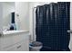 Well-maintained bathroom with a black and white polka dot shower curtain and a white vanity at 224 Coral Sunset Way, Summerville, SC 29486