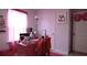 Bright bedroom with pink desk and red accessories perfect for a stylish and comfortable space at 224 Coral Sunset Way, Summerville, SC 29486