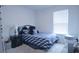 Comfortable bedroom with a geometric pattern bedspread and a window that lets in plenty of natural light at 224 Coral Sunset Way, Summerville, SC 29486