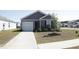 Charming single-Gathering home with a well-manicured lawn and a cozy front porch at 224 Coral Sunset Way, Summerville, SC 29486