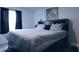Cozy bedroom with a large bed, blackout curtains, and a cityscape art piece above the headboard at 224 Coral Sunset Way, Summerville, SC 29486