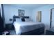Spacious main bedroom featuring a comfortable bed with side tables and artwork above the headboard at 224 Coral Sunset Way, Summerville, SC 29486