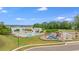 Aerial view of a pool, lake, playground and landscaping at 240 Woodbrook Way, Moncks Corner, SC 29461