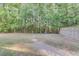 Spacious backyard with mature trees and a partial fence, perfect for outdoor enjoyment at 240 Woodbrook Way, Moncks Corner, SC 29461