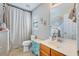 Charming bathroom featuring a decorative vanity and a shower with a neutral-toned curtain at 240 Woodbrook Way, Moncks Corner, SC 29461
