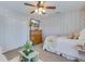 Cozy bedroom featuring a ceiling fan, television, and tasteful décor for a comfortable living space at 240 Woodbrook Way, Moncks Corner, SC 29461