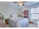 Bright bedroom with natural light, complemented by a comfortable bed and decorative elements at 240 Woodbrook Way, Moncks Corner, SC 29461