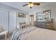 Inviting bedroom featuring a dresser, mirror, and a comfortable bed, creating a relaxing retreat at 240 Woodbrook Way, Moncks Corner, SC 29461